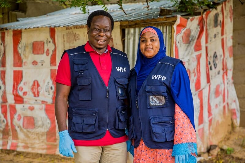 Emmanuel Bimba, WFP Programme Policy Officer, and Habiba Ibrahim, WFP Monitoring Assistant, in the field in Yobe State. ©Damilola Onafuwa