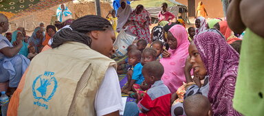 staff talking to beneficiaries