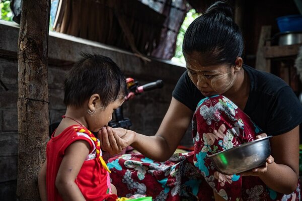 mother feeding a child