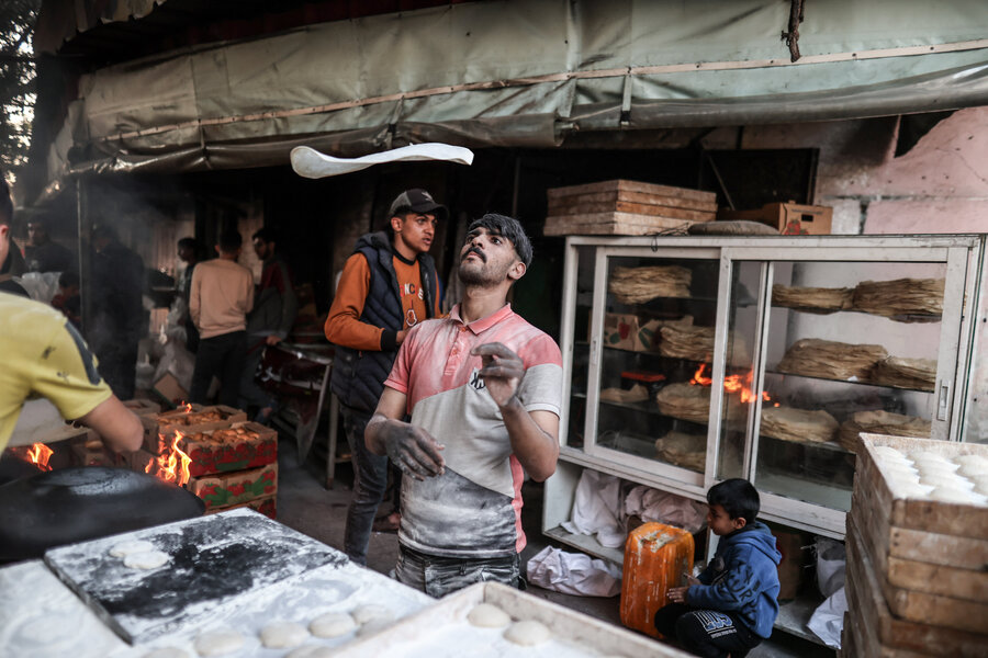 Gazans who can do so exchange wheat flour for traditional 'Saj" flatbread. Despite skyrocketing hunger, many people are fasting and eating only after sunset during this holy Muslim month of Ramadan.  Photo: WFP/Ali Jadallah